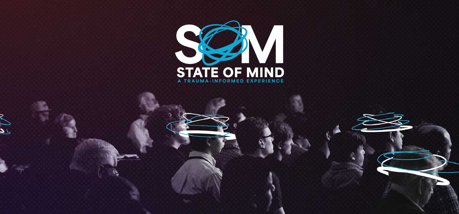 SOM logo overlay people at a conference